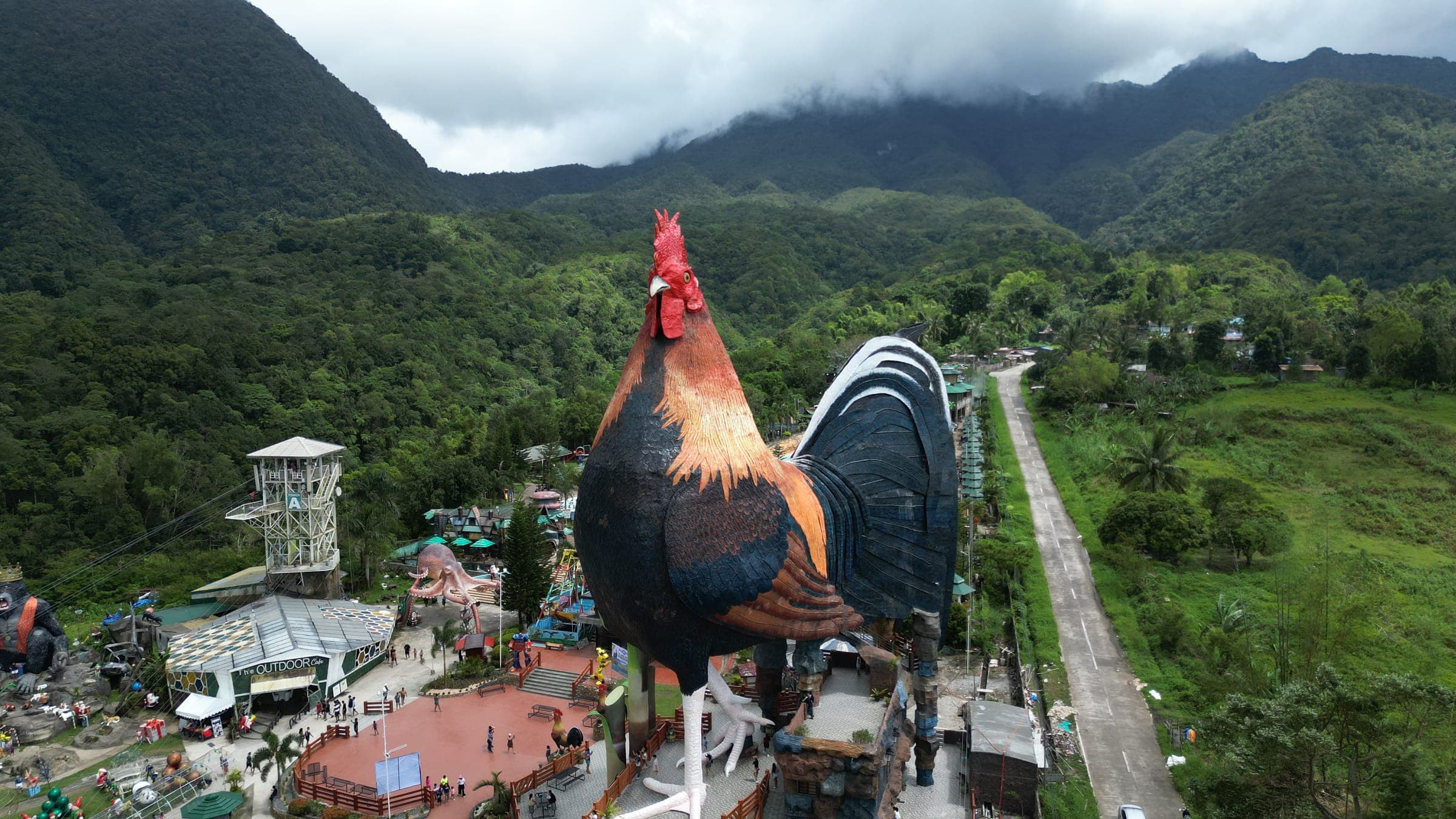 The Rooster building rising above Campuestohan Highland Resort at dusk